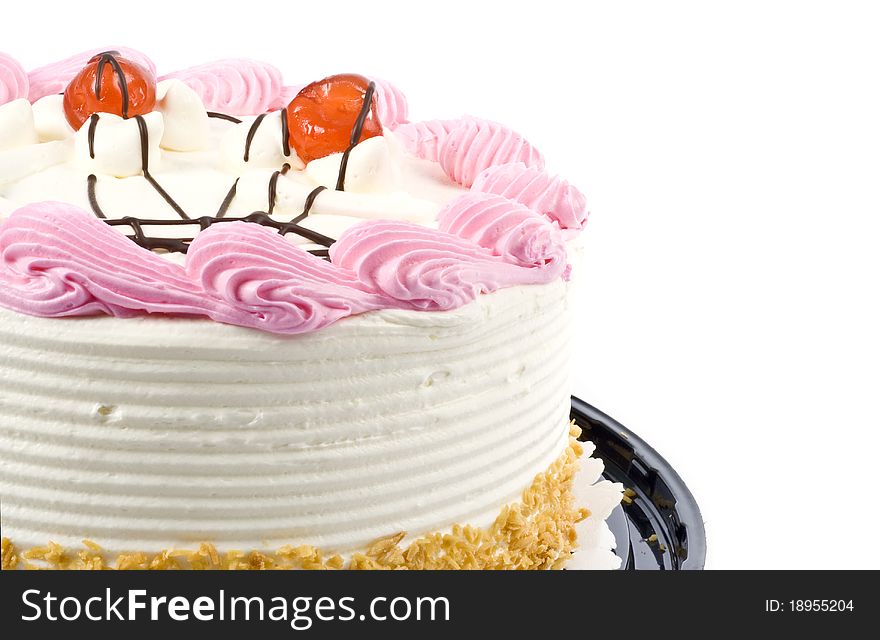 A white and pink birthday cake decorated with cherries. A white and pink birthday cake decorated with cherries.