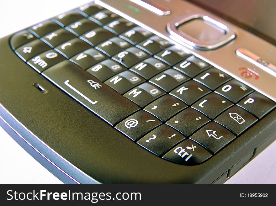 Image shows mobile phone keyboard close-up