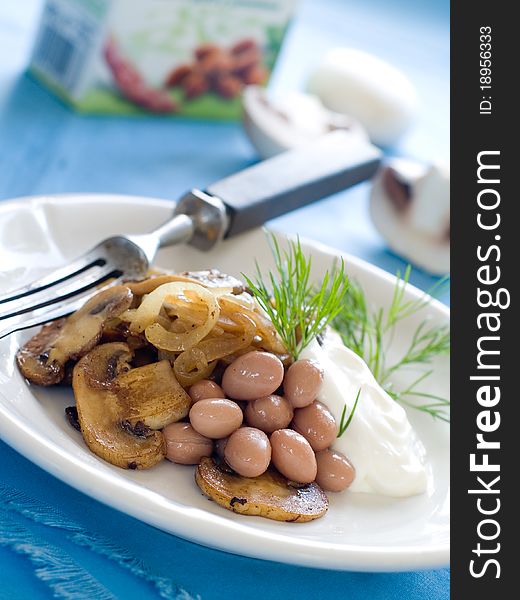 Bean and mushroom appetizer with onion and dill. Bean and mushroom appetizer with onion and dill
