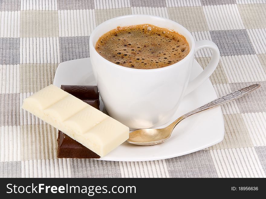 Coffee and chocolate on textile mat