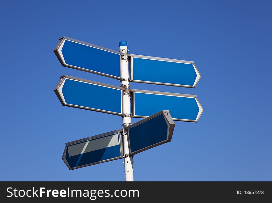 A sign with blue sky