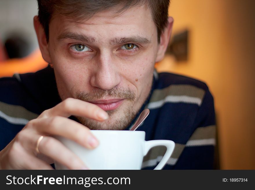 Happy Young Man Having A Cup Of Tea