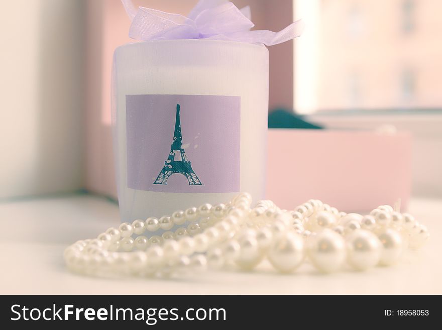 Romantic picture of women's accessories, candles and beads