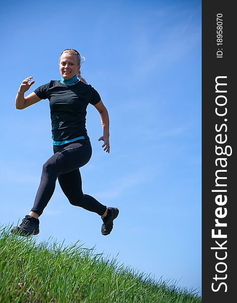 Woman training cross country running. Woman training cross country running