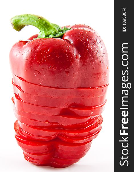 Picture of a sliced standing paprika on a white background. Picture of a sliced standing paprika on a white background