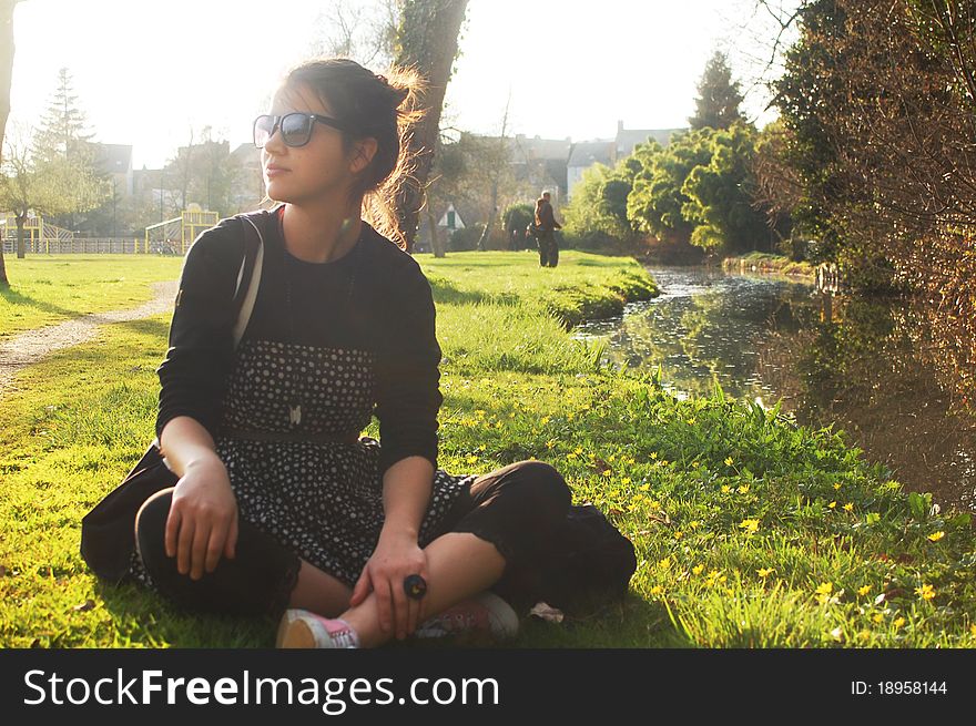 Young girl on the spring green grass. Young girl on the spring green grass