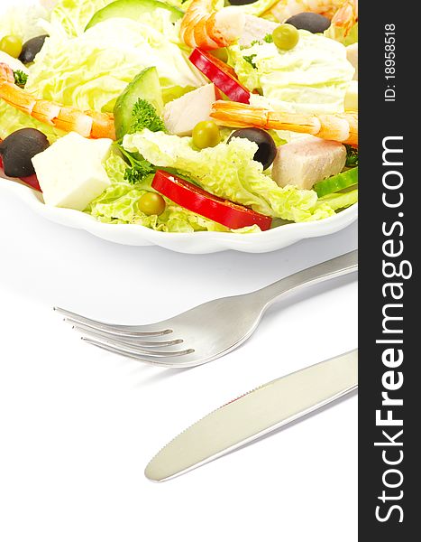 Vegetable salad in plate on white
