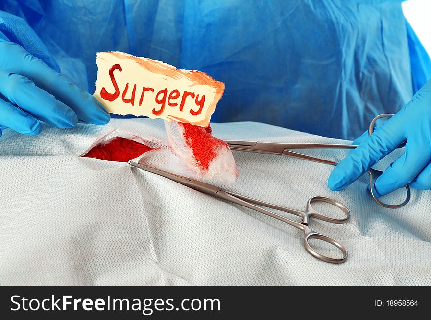 Surgeon making the problematic operation with lots of blood as a symbol of problem. Surgeon making the problematic operation with lots of blood as a symbol of problem