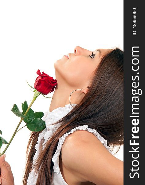 Pretty woman touching her neck by fresh single red rose flower on a white background. Pretty woman touching her neck by fresh single red rose flower on a white background