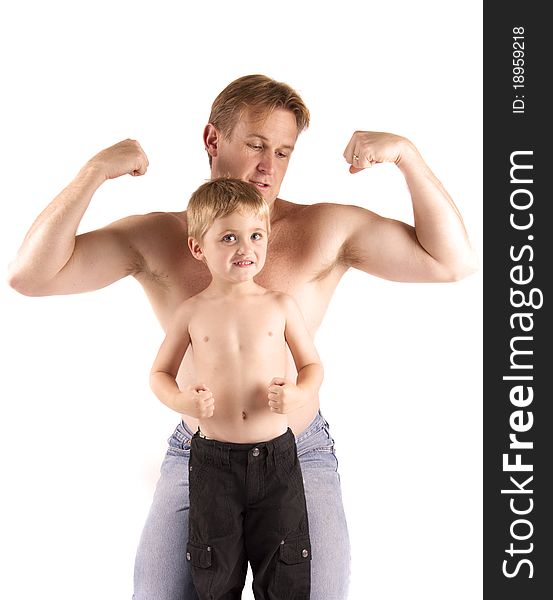Father and son showing their muscles off. Father and son showing their muscles off