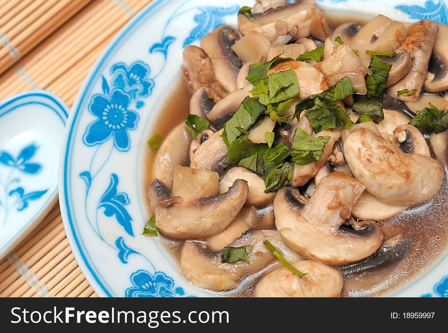 Closeup shot of Oriental style cooked brown mushrooms in gravy. Closeup shot of Oriental style cooked brown mushrooms in gravy.