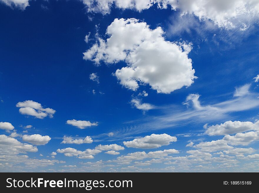 White clouds of different shapes, beautiful summer blue sky with clouds. White clouds of different shapes, beautiful summer blue sky with clouds