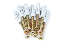 Brass Screw With Grey Plastic Anchor Isolated Royalty Free Stock Photo