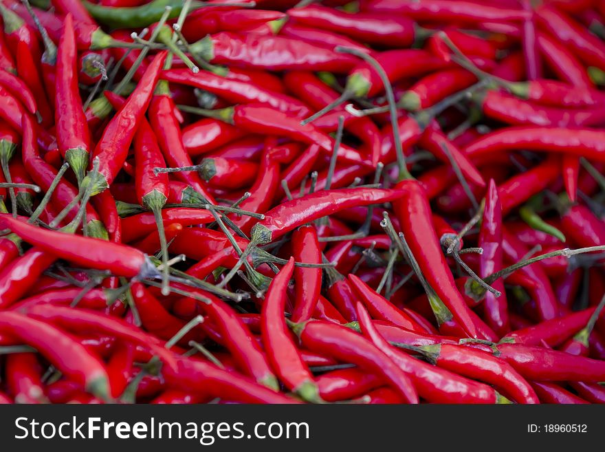 Spicy Hot Red Peppers on a street market table.