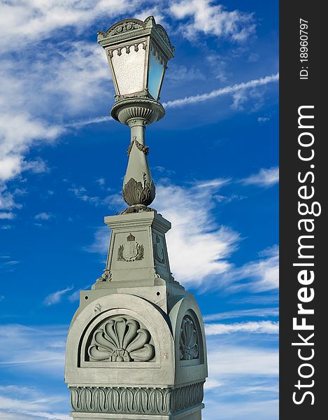 Vintage lamppost isolated on blue sky with clouds. Vintage lamppost isolated on blue sky with clouds