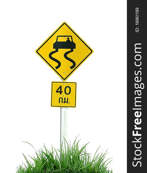 Yellow slippery road sign and green grass isolated on white background