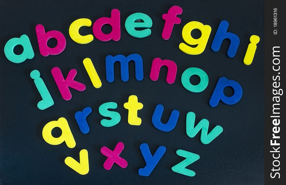Made of colorful rubber letters on the dark background. Made of colorful rubber letters on the dark background