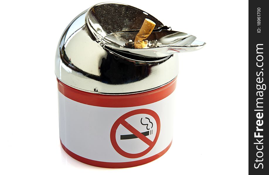 Cigarette and ashtray with a symbol of the smoking ban. Cigarette and ashtray with a symbol of the smoking ban