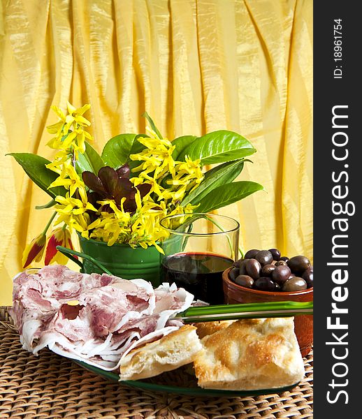 Typical Italian sausage sliced â€‹â€‹cake and flowers. Typical Italian sausage sliced â€‹â€‹cake and flowers