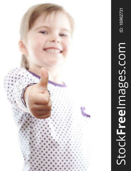 Little girl showing thumb up on white