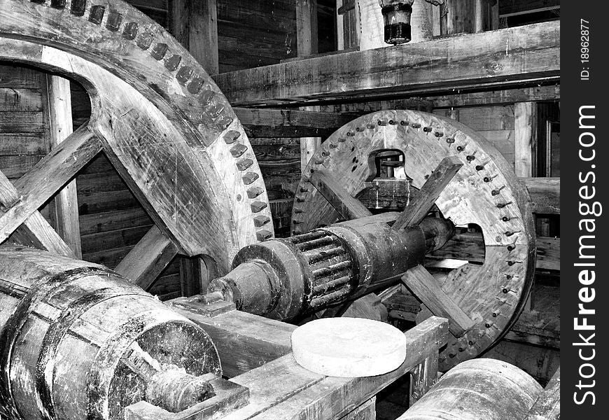 Black white of a watermill inside