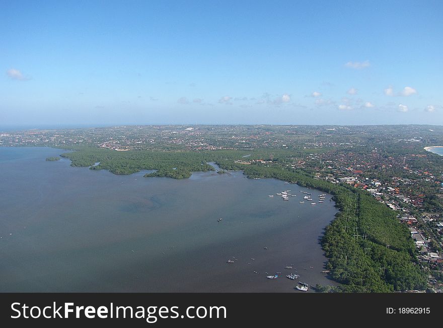 Photo of a the tropical resort island of Bali, Indonesia from the air. Photo of a the tropical resort island of Bali, Indonesia from the air.