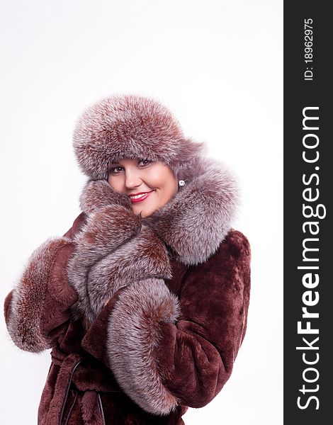 Woman smile in winter fur coat isolated. Woman smile in winter fur coat isolated