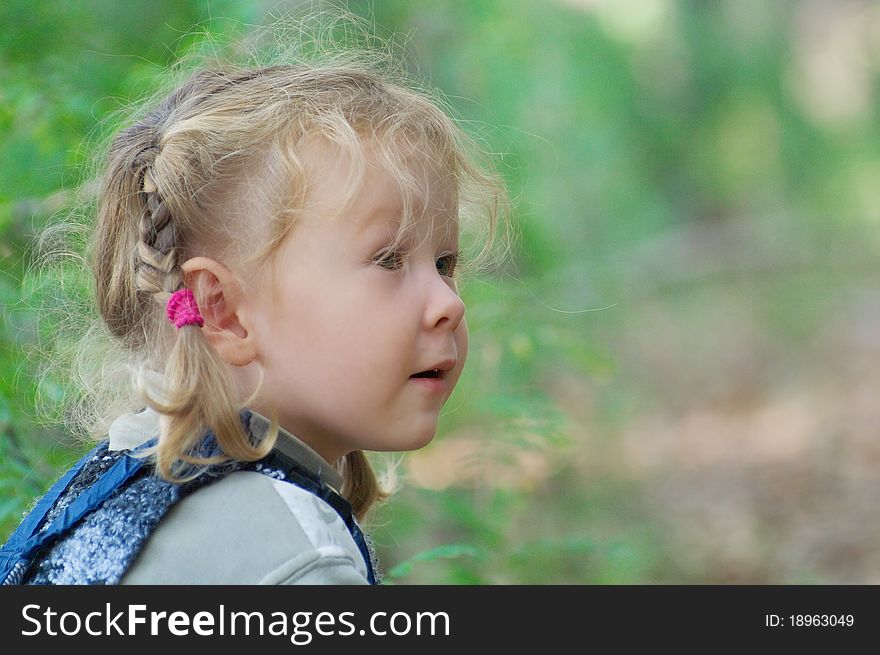 Little girl playing in the woods. Very artistic picture. Shallow DOF. Little girl playing in the woods. Very artistic picture. Shallow DOF.