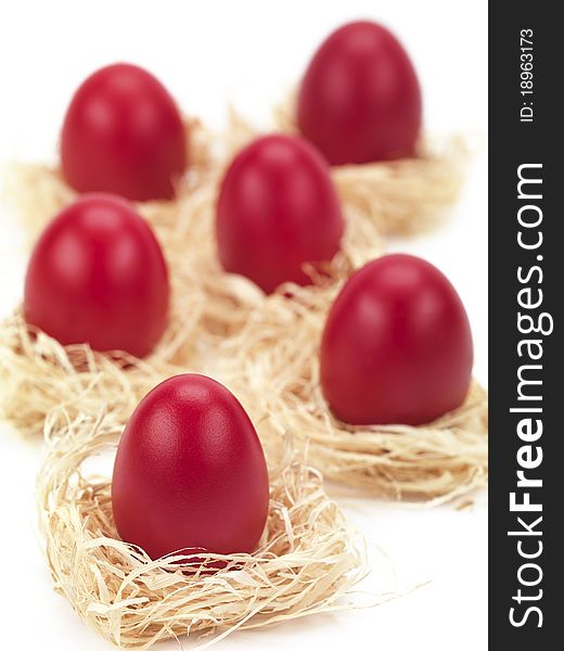 Red  eggs in nests for easter. Red  eggs in nests for easter