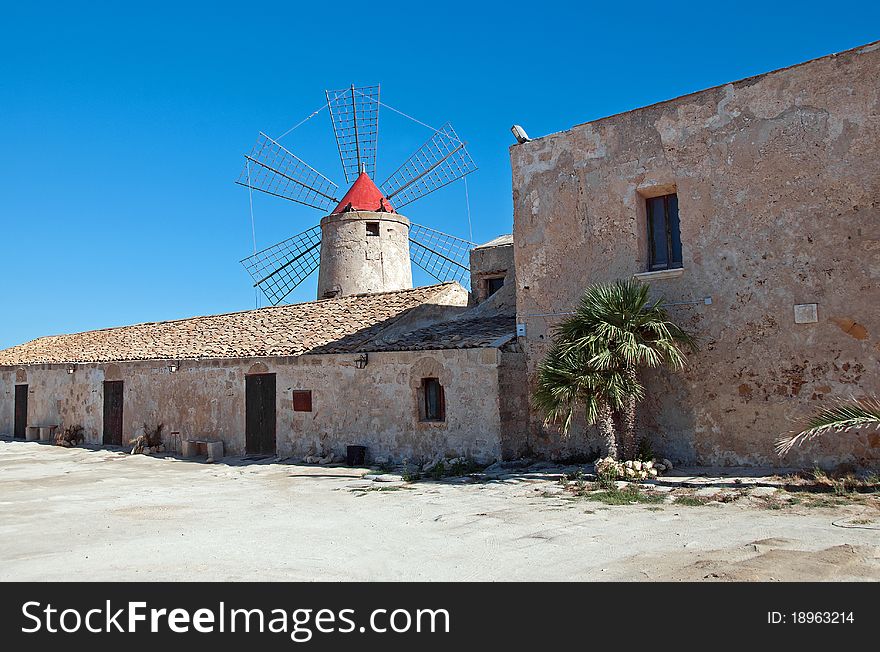 Ancient windmill located close to the saline in trapani. Ancient windmill located close to the saline in trapani