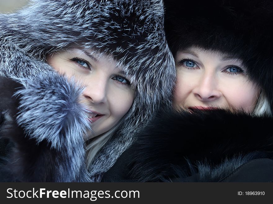 Beautiful woman in winter fur coat