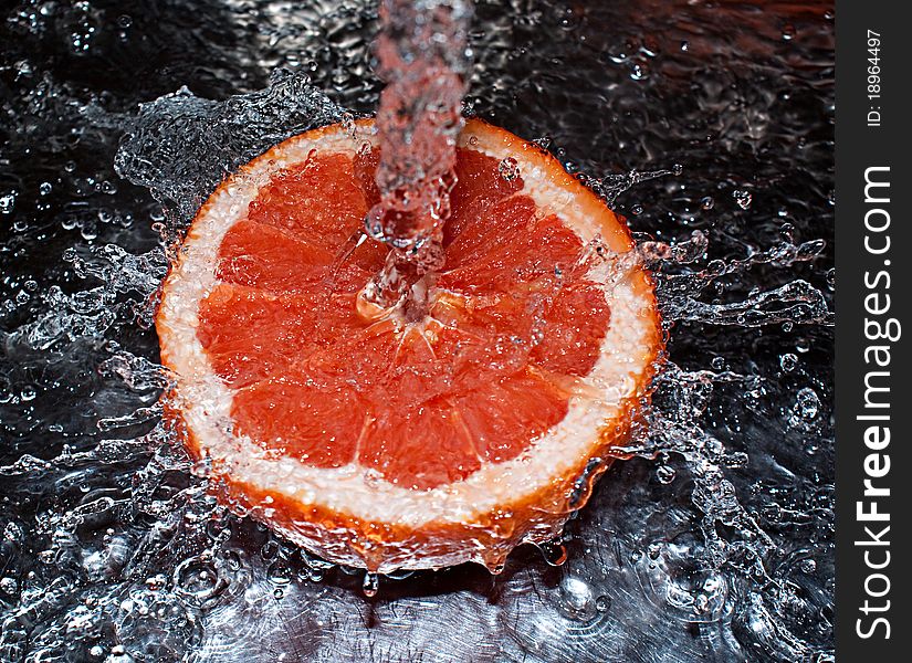 Water splashing over an oranges. Water splashing over an oranges
