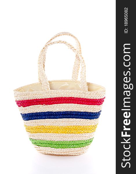 A cheerful straw bag isolated over white background. A cheerful straw bag isolated over white background