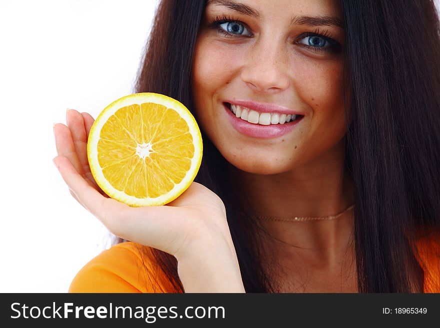 Orange in woman hands close up