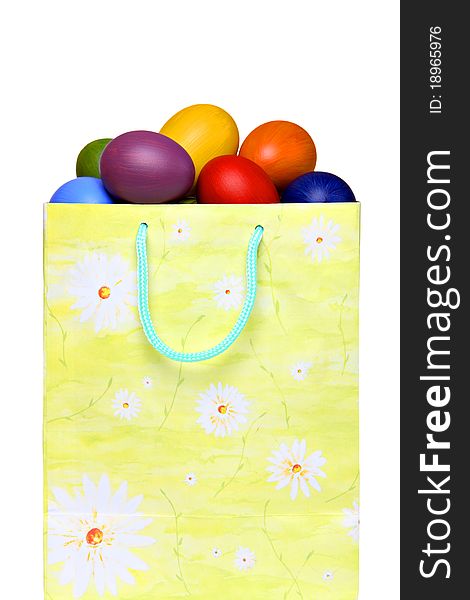 Colorful Easter eggs in gift bag, isolated on white