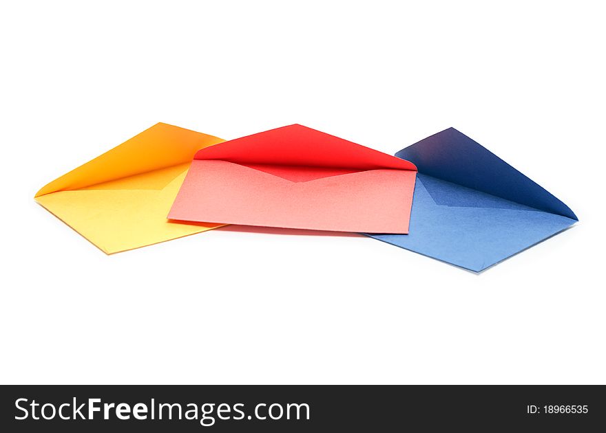 Colorful empty envelopes lying in a row on white background. Clipping path is included