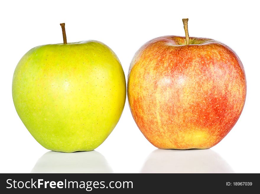 Green and red apples are isolated on the white.