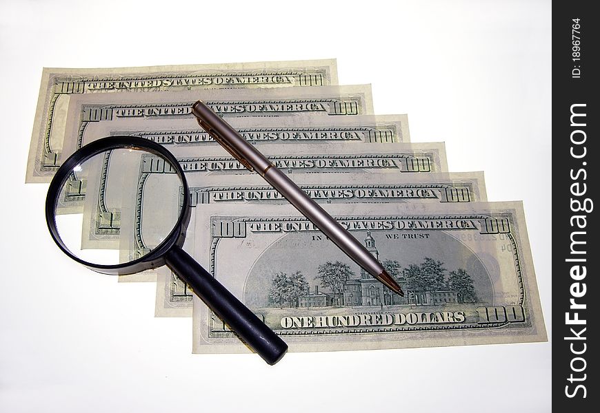 U.S. dollars and a Magnifying glass.