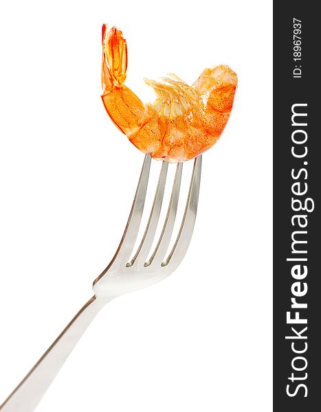 Shrimp on fork over white background