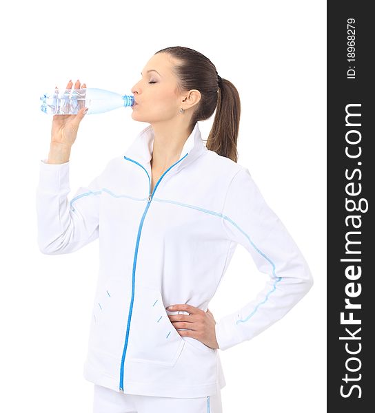 Woman in sportswear drinking water, isolated on white. Woman in sportswear drinking water, isolated on white