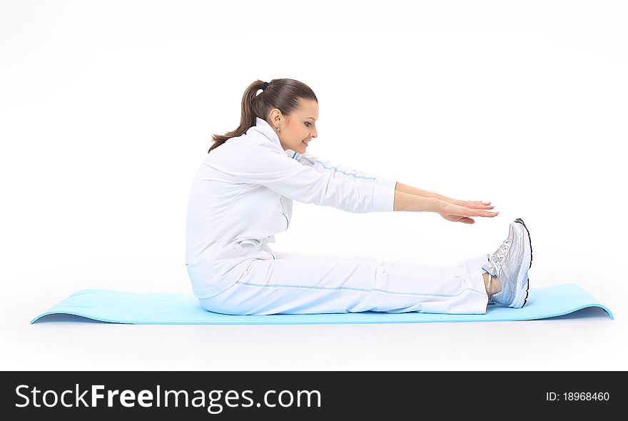 Woman doing stretching on a mat