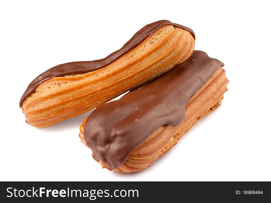 Two chocolate eclairs isolated on a white background