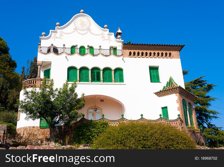 Old white Spanish house located in Gaudi's Parc Guell. Old white Spanish house located in Gaudi's Parc Guell.