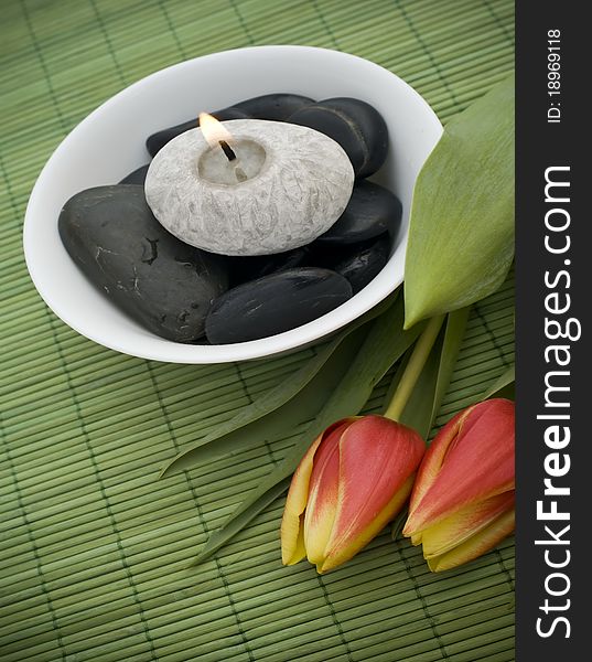 Spring zen like SPA with red tulips and candle