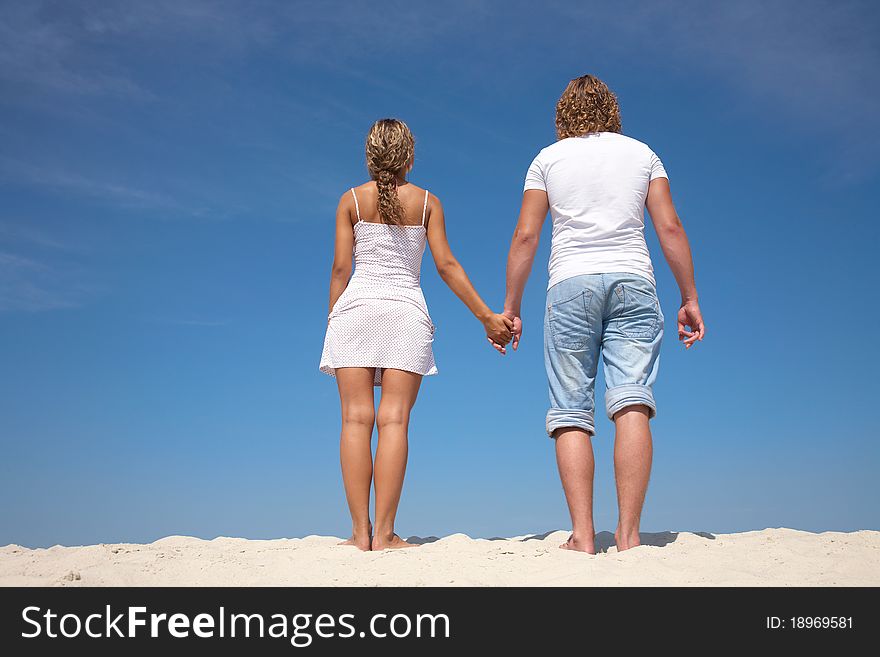 Young attractive couple at the beach