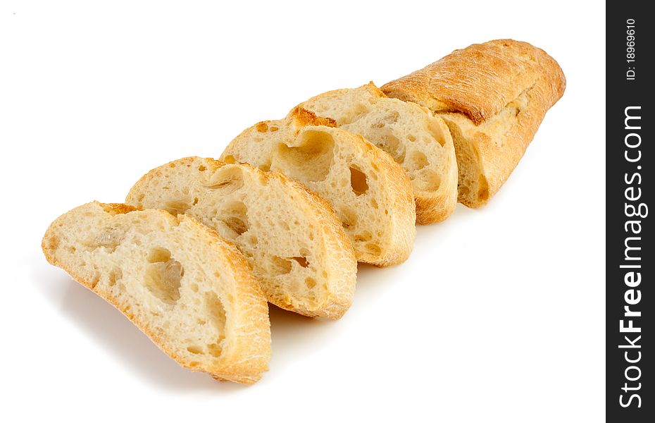Bread (baguette) is cut on a white background. Bread (baguette) is cut on a white background.