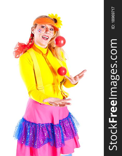 A girl dressed as Pippi Longstocking juggling