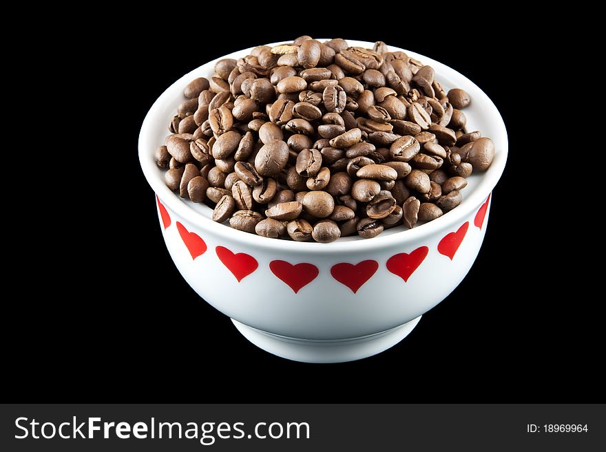 Picture of some coffee beans in a white heart yar. Picture of some coffee beans in a white heart yar