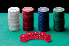 Dice And Poker Chips On A Black Background Stock Photography