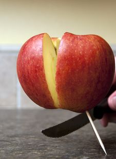 Apple Being Cut In Half Royalty Free Stock Image